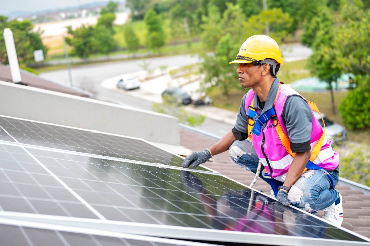 Installer beside a completed panel row